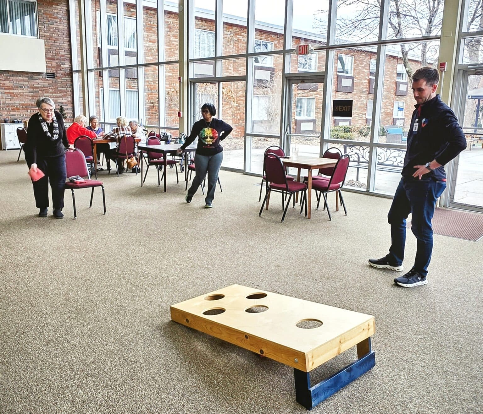 genesis-village-residents-playing-bean-bag