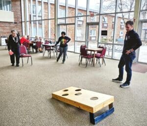 genesis-village-residents-playing-bean-bag